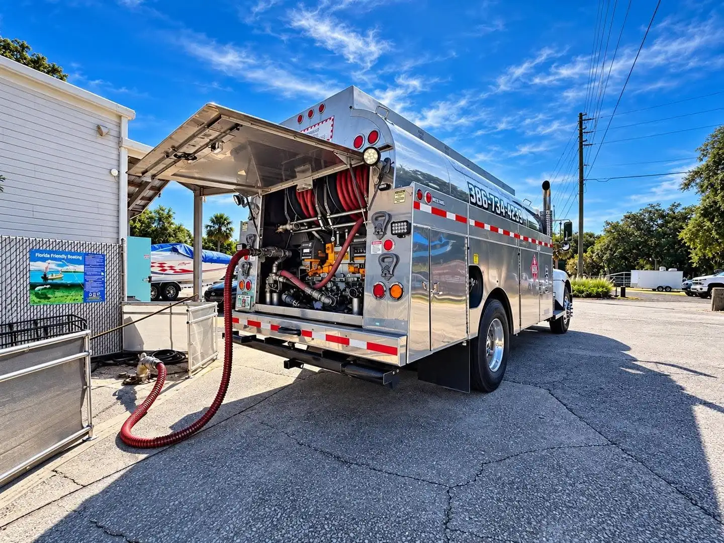 Rear pump compartment of the Gentry Oil tanker truck fueling at a marina